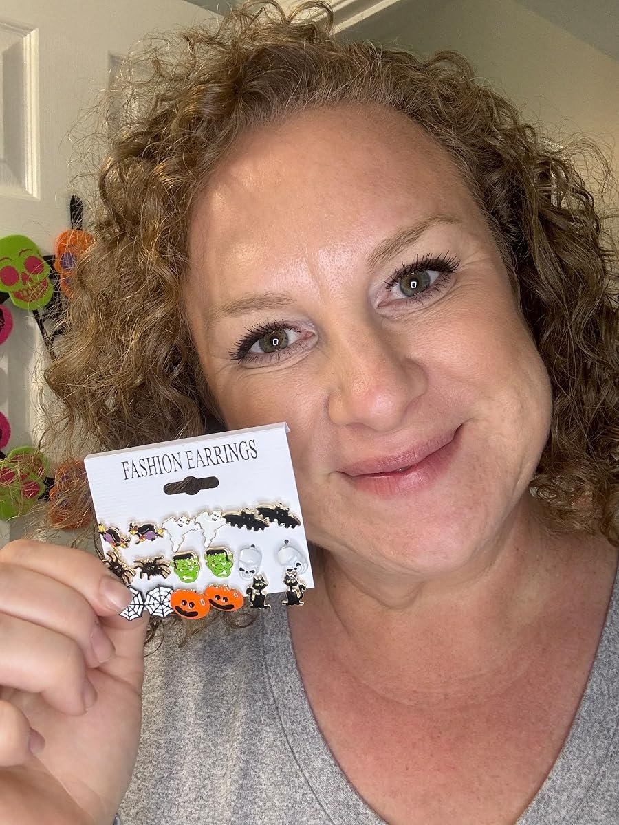 Erin holding her set of Halloween earrings