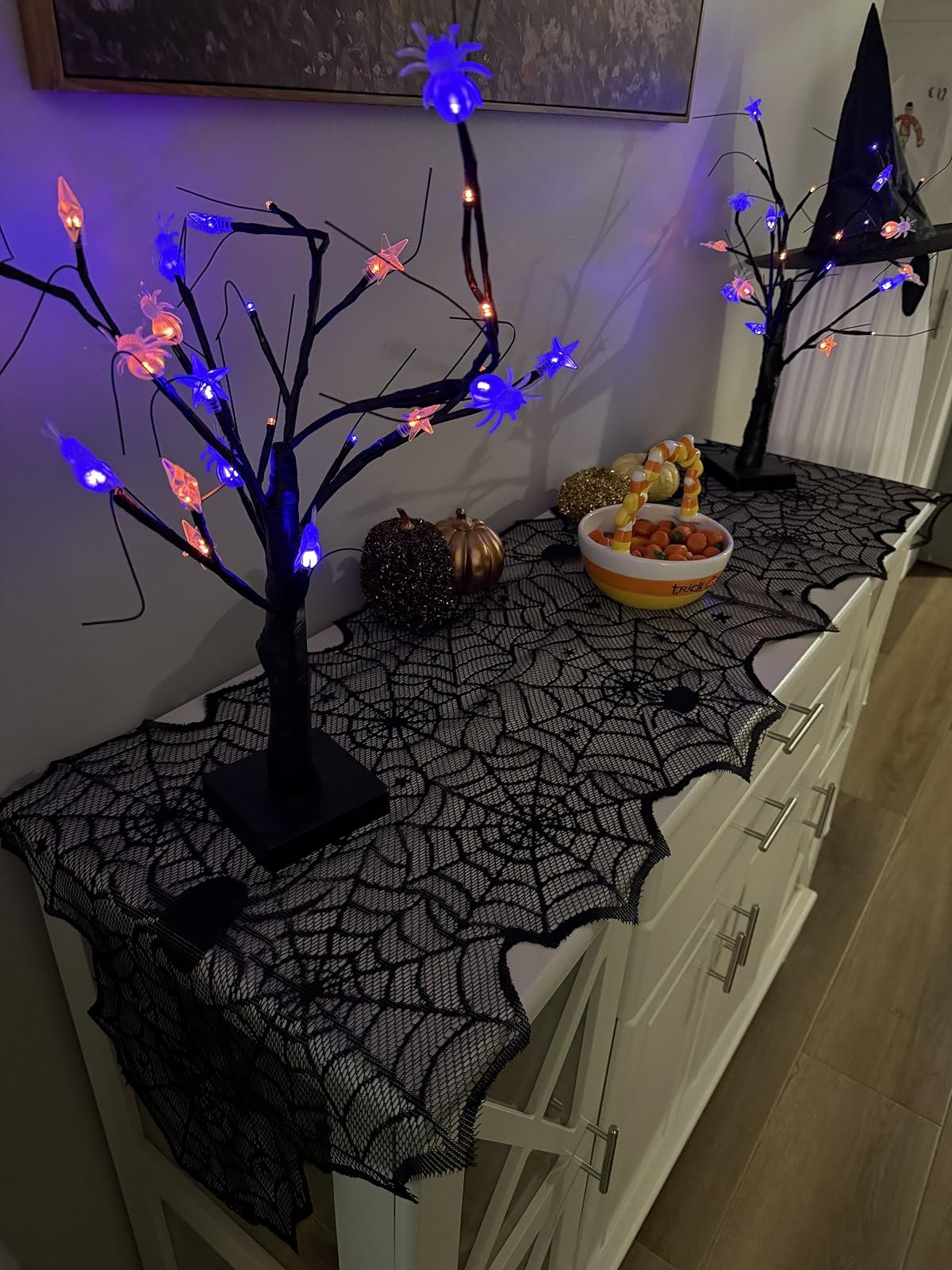 Spider web runner with LED trees, pumpkins and a candy bowl